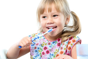 child brushing teeth